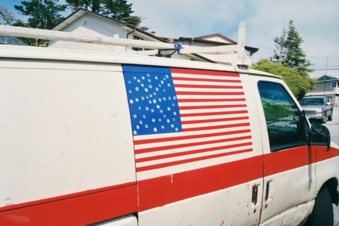 an american flag painted on the side of a van